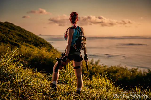 Bianca Beauchamp as an adventurer looking out to sea at sunset