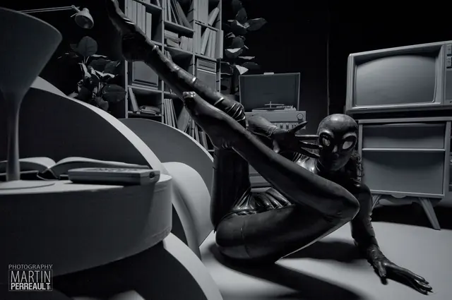 Figures in black latex in a library, in black and white