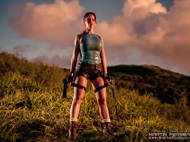 Bianca Beauchamp as an adventurer on a hilltop at sunset