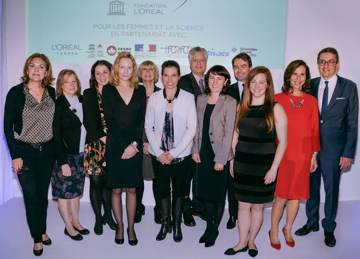 Group photo in front of the For Women in Science backdrop