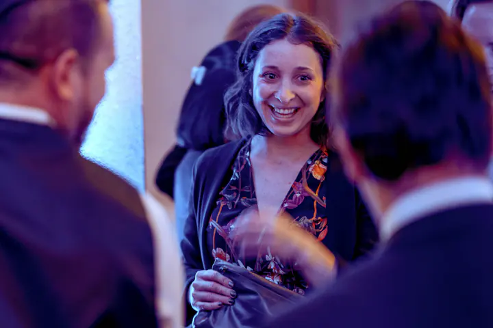 A guest laughing during a conversation